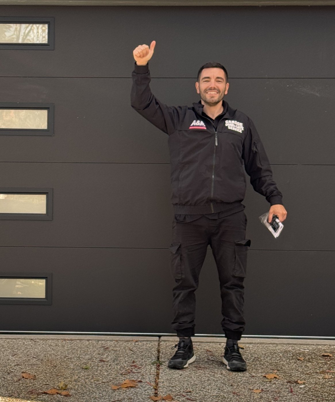 Avi Mizrahi, owner of A&M Garage Door & Gate Service, in front of a newly installed Sacramento garage door