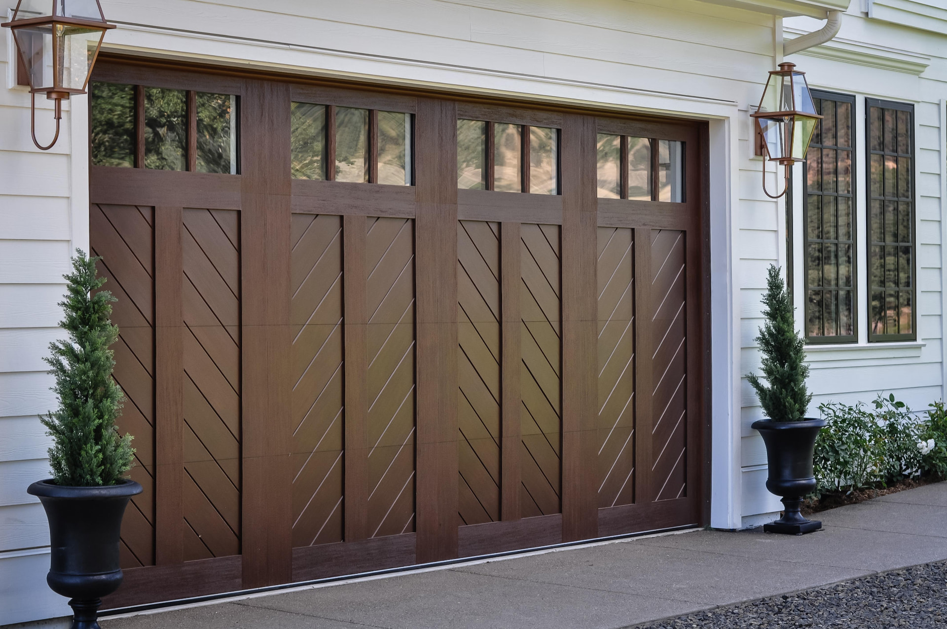 Insulated wood-look garage door installed on a Sacramento-area home