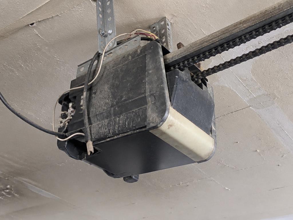 Before: garage door opener repair problem on a Sacramento area garage door